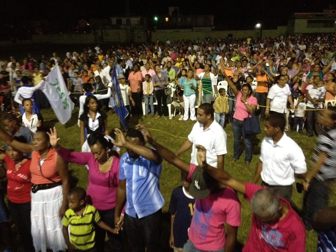 A crusade crowd worshiping God